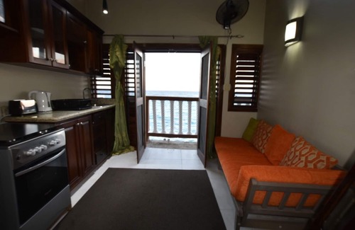 Tower Isle Apartment | Ship watchers Oceanfront Tiny House Retreat with Mezzanine and Private Jetty