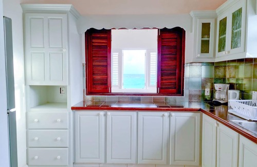 Silver Sands Apartment | Silver Sands Beachfront Condo, Shared Patio - Bar & BBQ, Indoor & Outdoor Dining