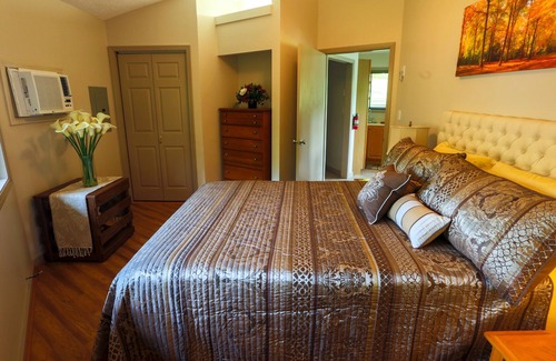 Asheville Cottage | Single little detached round house with one queen bed, kitchenette, and bath