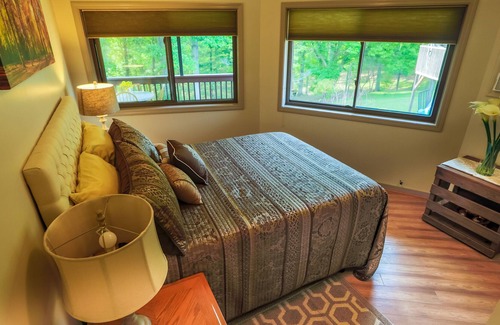 Asheville Cottage | Single little detached round house with one queen bed, kitchenette, and bath