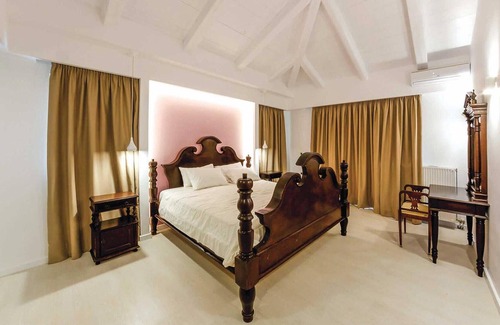 Drosia House | Situated within lush, beautifully maintained gardens, this renovated stone built property is a stunn