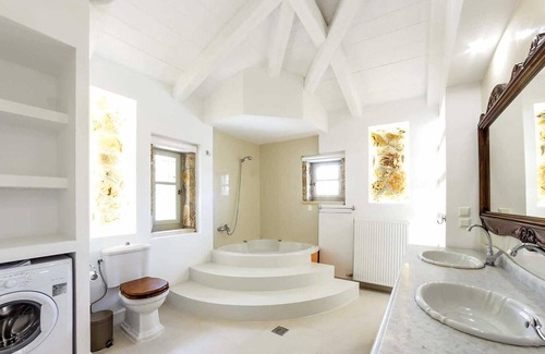 Drosia House | Situated within lush, beautifully maintained gardens, this renovated stone built property is a stunn