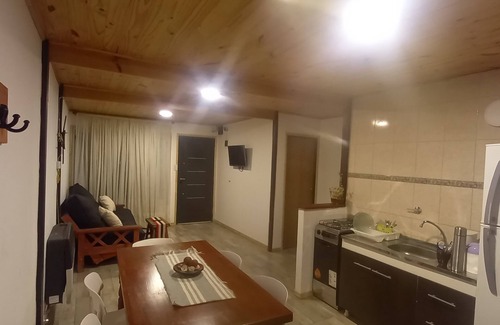 Trevelin House | "Small house on a raised hill, facing the imposing Andes mountain range."