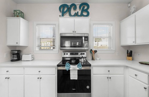 Bel Air House | Spacious Beachside Townhouse with Lagoon access, 2 car garage, and a pool!l