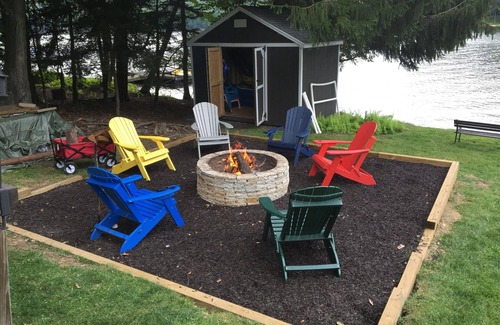 Treasure Lake House | Spacious Lakefront Log Home with large lakefront porch, firepit