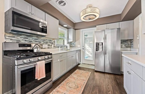Wauwatosa House | Spacious Milwaukee Getaway | Game Room Theatre Fenced Yard