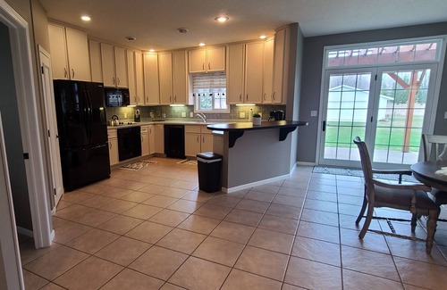 Starbuck House | Spacious one-level family friendly, tranquil backyard with boat access.