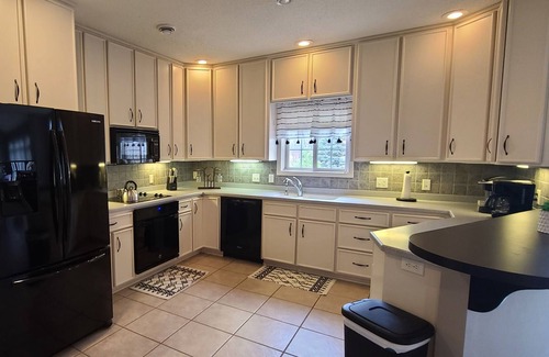 Starbuck House | Spacious one-level family friendly, tranquil backyard with boat access.