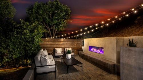 Mission Viejo House | Spanish-Inspired Mission Viejo Home with Courtyard Firepit Backyard Dining Casa Cordero by AvantStay