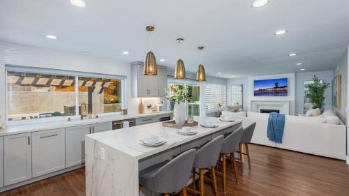 Mission Viejo House | Spanish-Inspired Mission Viejo Home with Courtyard Firepit Backyard Dining Casa Cordero by AvantStay