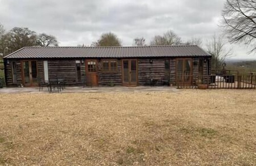 Horspath House | Stable lodge with cosy log fire