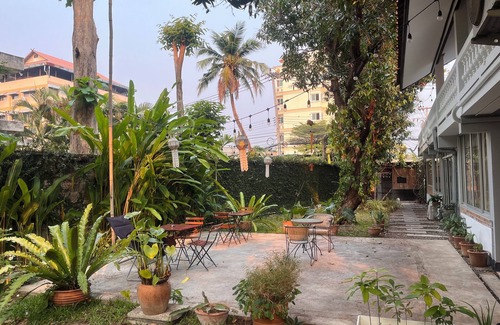Chang Phueak House | Stay in Style: Cozy AC Room, Tropical Garden & Prime Location.