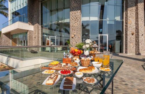 Lonavala Villa | StayVista's Emerald Acres offering a heated pool, bonfire, snooker table, scenic views, tennis court, steam room, gazebo, & gym