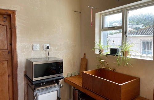 Kalk Bay Apartment | Studio apartment in the heart of Kalk Bay, 1 minute walk to the beach.