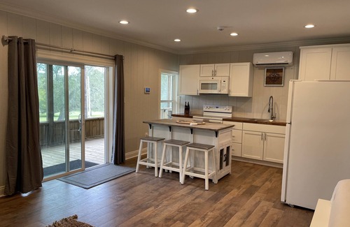 Mermentau Apartment | Studio style top floor apartment on the Mermentau River with pool and river view