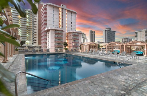 Waikiki Apartment | Studio with hardwood floors, ocean views - pool, hot tub, & sauna on-site