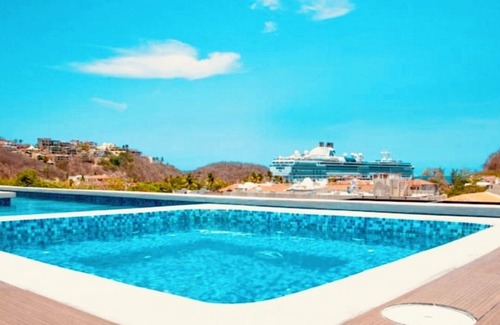 Santa Maria Huatulco Condo | Stunning 2-bedroom condo with rooftop pool & walking distance beach in Huatulco.