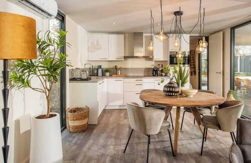 Maasbree House | Stylish and compact hideaway for two with private terrace and large windows, surrounded by forest in North Limburg.