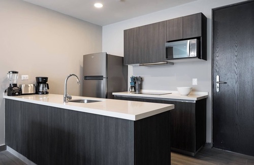 Monterrey Apartment | Stylish Apartment: Pool, Gym & Mountain Scenery
