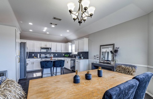San Angelo House | Stylish corner home with cozy interiors, a private bar, and inviting charm