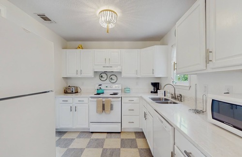 Beach Institute Hotel | Stylish southern stay with two full homes in one, quaint backyard, and walkable