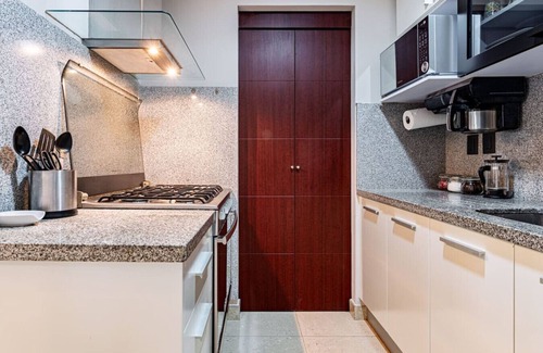 Ampliacion Granada Apartment | Stylish Urban Escape with Pool, Gym & BBQ in Prime Location