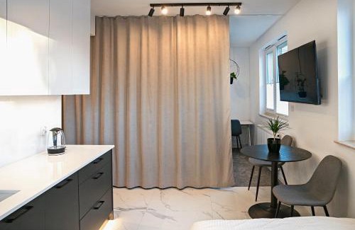 Wola Duchacka Apartment | Stylish Urban Retreat by UR4N!