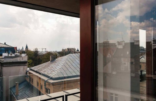 Kleparz Apartment | Sunny penthouse in New York style