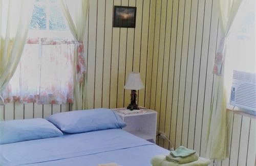 Fitts Village House | Sunset Breeze Guest House is perfect for your relaxing getaway.