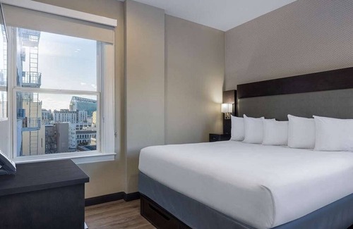 Theater District Hotel | Super 8 hotel room, in the heart of San Francisco for your Dreamforce stay.