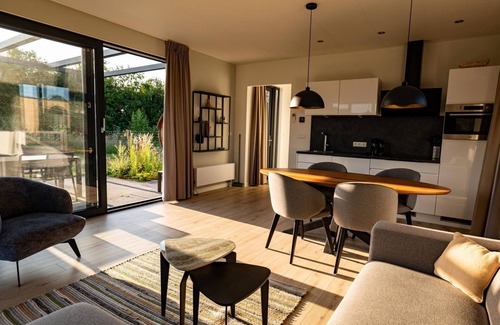 Kotten House | The Amalia is a 4-person holiday home with a cozy and homely living room with an open kitchen, 2 bedrooms, and a spacious outdoor area.