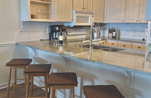 Pine Knoll Shores Condo | The Emerald View- Oceanfront- Top Floor- 3 Pools