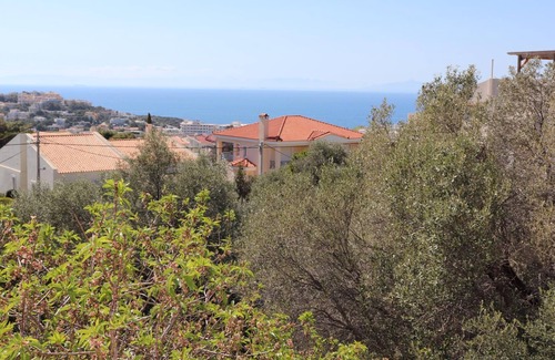 Saronida Apartment | The holiday apartment is in a beautiful and quiet hillside location close to the
