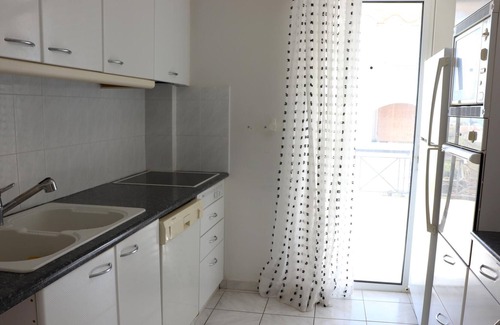 Saronida Apartment | The holiday apartment is in a beautiful and quiet hillside location close to the