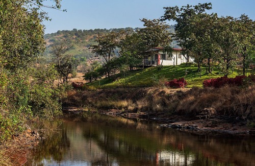 Ambavna Villa | The Lazy River Cottage by cosmicstays