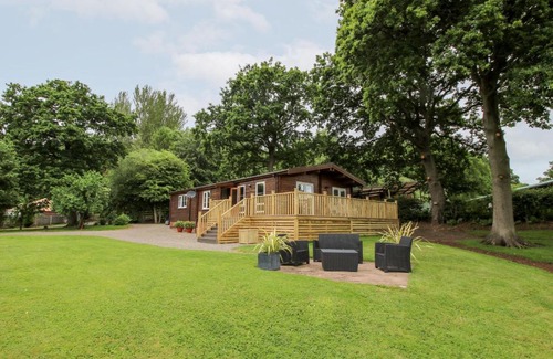Newnham House | The Log Cabin