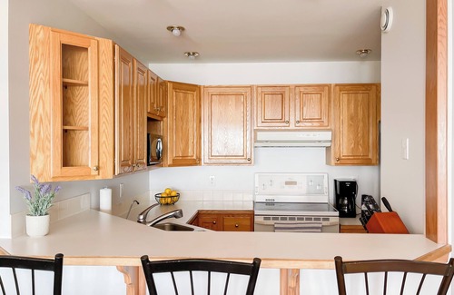 East River Point House | The oceanside Hideaway is nestled between the trees with stunning ocean views