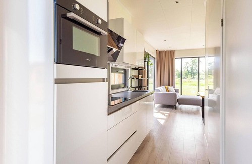 Kotten House | The six-person Parklodge 6 with Dog Fence, Sauna and Hot Tub has a spacious living room, open kitchen, three bedrooms and a spacious patio.