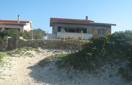 Sa Rocca Tunda Villa | The Sound of the Sea. House on the beach, surrounded by greenery, Sardinia.