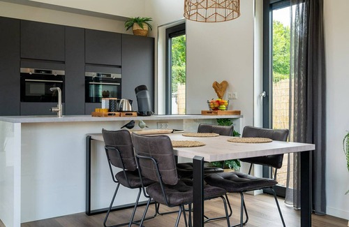 Ouddorp House | This attractively furnished holiday home with a large terrace, is located on a quiet family park and close to the sea and beach.