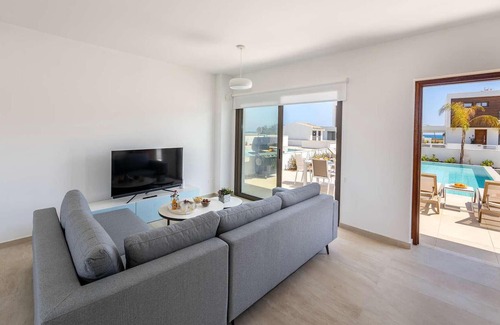 Softades House | This brand-new villa, situated on an exclusive gated development with landscaped gardens, is only mi