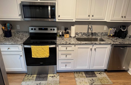 Sumter House | This charming 2-bed, 1-bath house offers a warm sanctuary for those on the go.