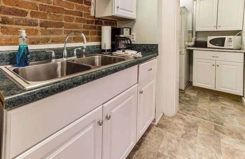 Old West Broad Neighborhood Apartment | This Classical Parlor is located on Chatham Square. It offers a quiet retreat with natural light, floor-to-ceiling windows, and views of the Square.