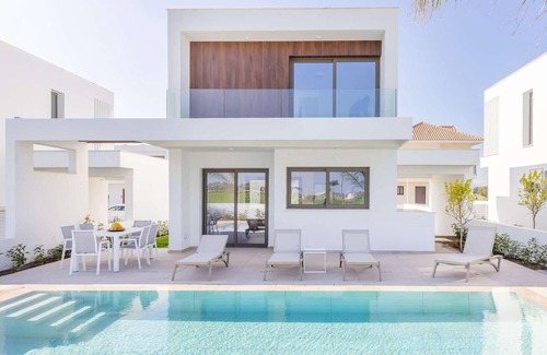 Softades House | This contemporary villa on a gated complex has pretty landscaped gardens and is only a few minutes’