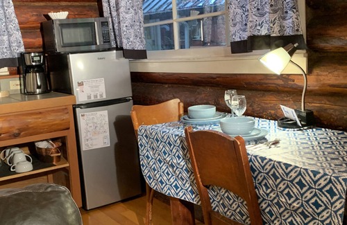 Ashford Cabin | This historic log cabin is adjacent to Copper Creek Restaurant just a few miles to Mt. Rainier National Park. Hot tub, full kitchen, gas fireplace, romance!