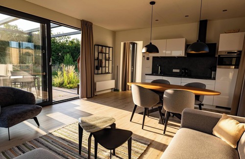 Kotten House | This holiday home with a fully enclosed dog fence, private sauna and hot tub features a cosy, homely living room with open kitchen, 2 bedrooms and a spacious outdoor area.