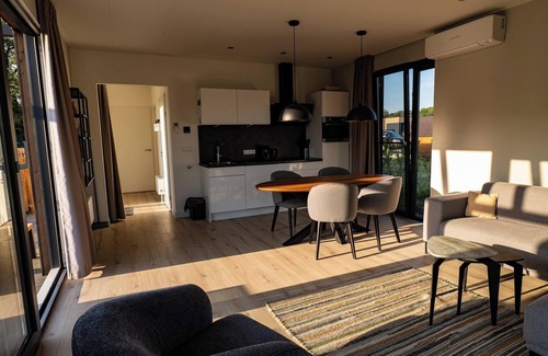 Kotten House | This holiday home with a fully enclosed dog fence, private sauna and hot tub features a cosy, homely living room with open kitchen, 2 bedrooms and a spacious outdoor area.