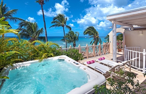 Reeds Bay Condo | This Penthouse is situated directly on a beautiful sandy beach and has a wonderful roof deck terrace