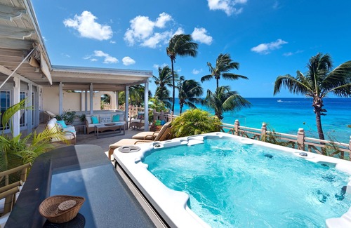 Reeds Bay Condo | This Penthouse is situated directly on a beautiful sandy beach and has a wonderful roof deck terrace