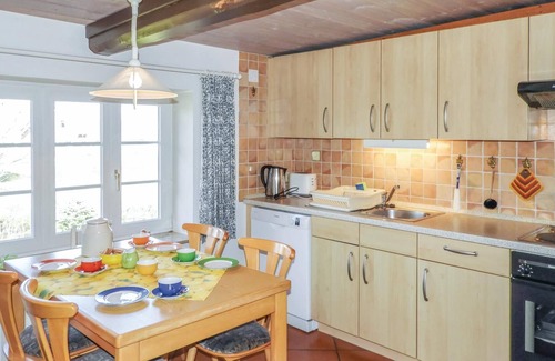 Neugalmsbull House | This quaint thatched house was made into a cozy vacation home for 4 people without losing the typica